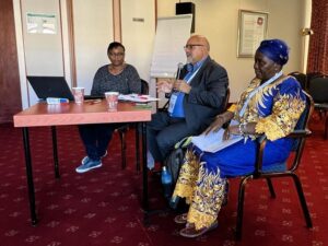 At a panel - Jane Thirkwa of KAIROS, Zoughbi Zoughbi of Wi'am and , Jackcilia Salathiel of South Sudan Council of Churches