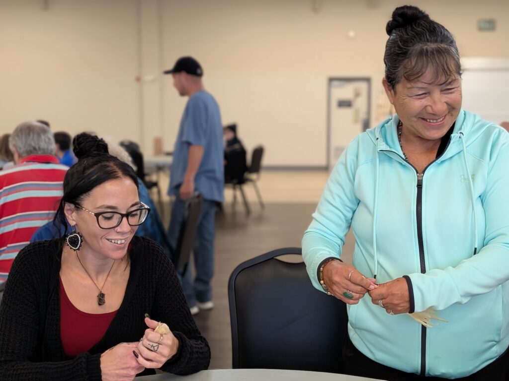 Wisdom in Action, corn husk dolls making on day 1. Artist and teacher Paula Longboat (right) with Brandi Bilodeau, Six Nations of the Grand River, August 2026.